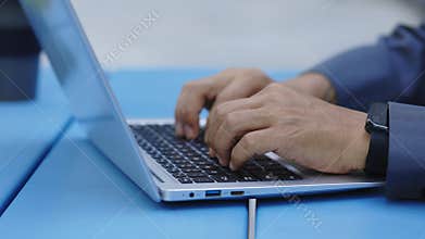 Close-up View of Man&#x27;s Hands Typing on Laptop. Businessman Working, Writes Message on a Computer. Hands of a Senior
