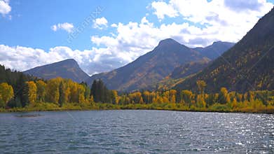 Beautiful Marble Lake Colorado Autumn Yellow Aspen Trees Mountains Blue Sky Clouds on Sunny Day