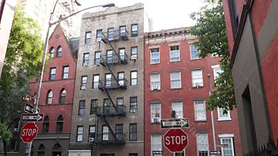 New York City building architecture. Urban residential house exterior. Real estate. Red brick facade