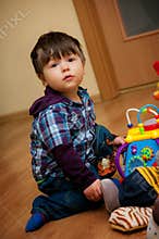 Young boy playing with toys
