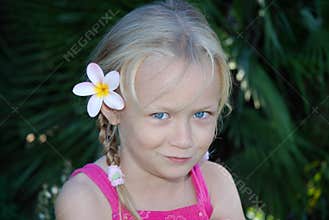 Cute girl with flower in hair