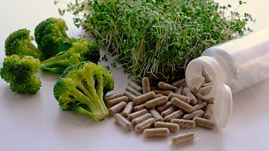 Sulforaphane supplements with broccoli sprouts. Selective focus.