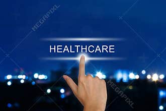 Hand pushing healthcare button on touch screen
