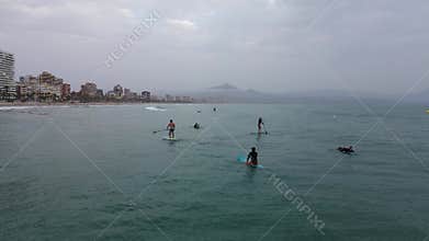 Aerial drone footage capturing a scenic coastal view in Alicante, Spain, filmed from above with a calm, cinematic