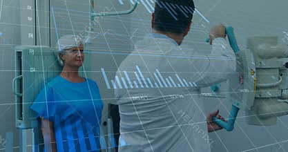 Medical technician adjusting C-arm while patient holding still and calibration charts appearing