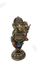 Statue of Ganesha holding a musical instrument while standing on a round base in an indoor setting with soft lighting