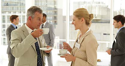 Business people chatting at a conference