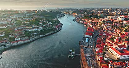 Porto cityscape with Douro River and Ribeira district at sunset
