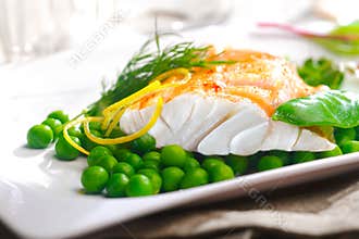Delicious oven baked fish fillet with peas