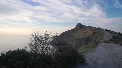 Sunrise morning view of the ocean with mountains in the background. New world view of the sea and mountains from Cape Kapchik