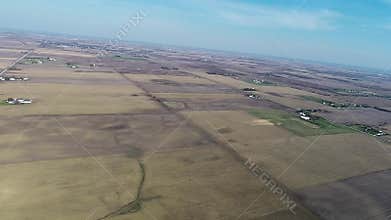 Aerial view flyover agriculture fields and farmland in Illinois corn belt - Midwest America