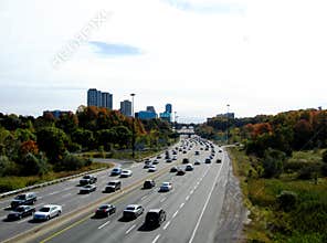 The picturesque Don Valley Parkway in Toronto in the fall. medium car traffic