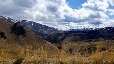 Idaho foothills in spring, mountain backdrop