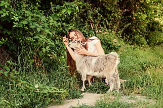 Love. farm and farming concept. Animals are our friends. happy girl love goat. village weekend. summer day. Love and