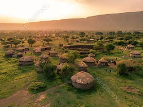 Aerial Drone Shot. Traditional Masai village at Sunset time near Arusha, Tanzania