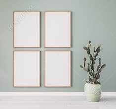 Minimal frame mock up design, succulent plant. four wooden frames on pastel green wall