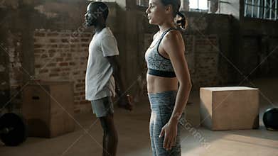 Sport people doing squat exercise workout at gym indoors