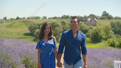 Mixed race couple enjoying a walk in floral glade