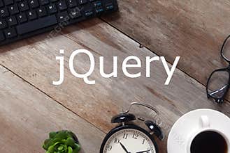 Top view of Keyboard,sunglasses, a cup of coffee,clock and plant on wooden background written with jQuery
