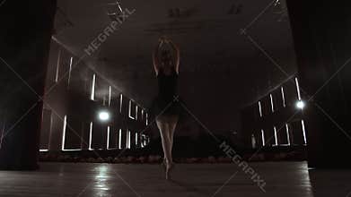 SLOW MOTION. unrecognizable beautiful ballerina performing on dark smoke stage. Blonde woman with hair in black. Ballet