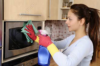 Girl cleaning the house