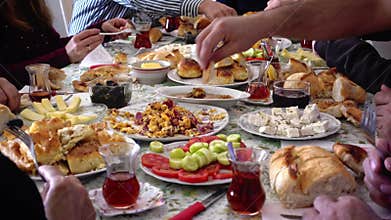 Muslim family having breakfast together celebrating eid-ul-fitr after Ramadan