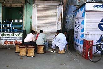 Playing cards in the street