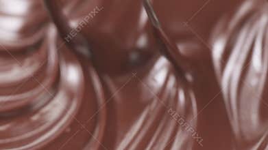 Slow motion mix milk chocolate with whisk