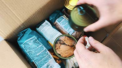 Man filling food box with donations