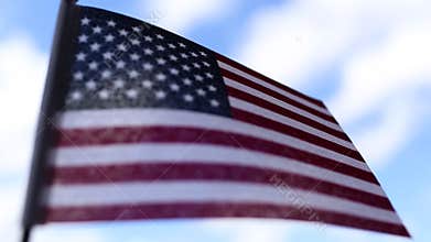 American flag on blue sky background for Memorial Day or July 4th.
