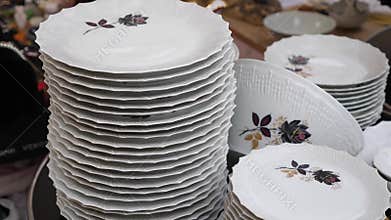 Nice Monday Antique market panning up crockery to show market and people.