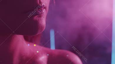 Night portrait woman glitter lips purple smoke