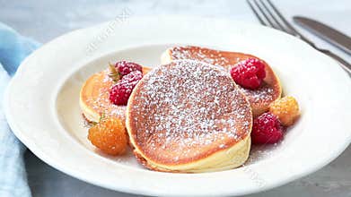 Japanese fluffy pancakes with raspberries. Japanese cuisine concept.