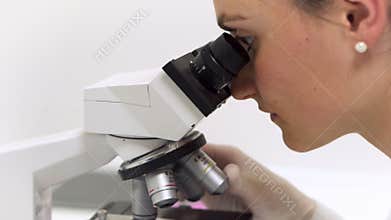 Scientist researcher using microscope in laboratory. Medical healthcare technology and pharmaceutical research and