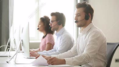 Male call center agent wear wireless headset consulting customer