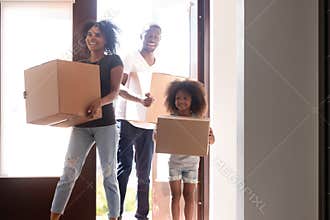 Happy african family with little daughter arrive at new home