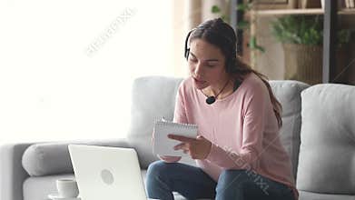 Woman wearing headset with microphone learning english with teacher online