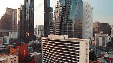 Thailand Bangkok aerial drone shot cityscape and downtown birdseye, panning around tower and transportation intersection
