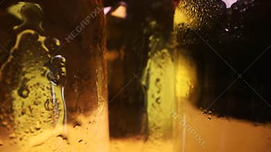 closeup of cold beer bottles with water drops