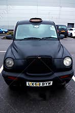 Black taxi parked in London, England