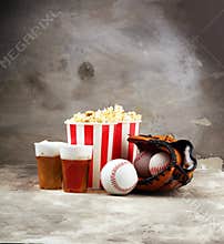 Popcorn on the table with draft beer. Baseball party food with balls for the playoffs