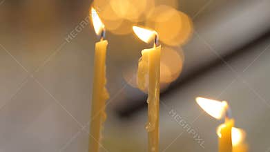 Burning candles in the church