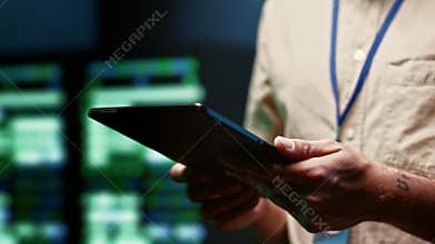 Repairman imputing data in server room