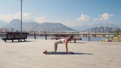Caucasian beautiful woman doing yoga in the park. Be H3althy