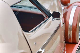 Shiny old time car red and cream