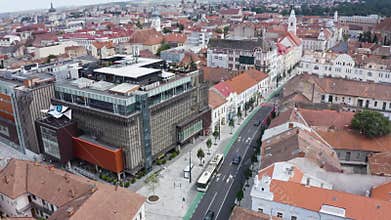 Aerial daytime view above downtown Cluj, Romania. Historical buildings and traffic. Ferdinand street