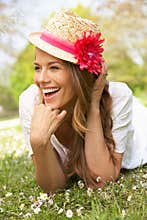 Woman Lying In Field Of Summer Flowers