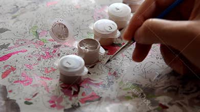 Aspiring artist amateur trains diligently, painting with brush no paint