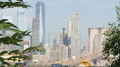 Cars on Brooklyn Bridge. New York City Manhattan skyline, downtown cityscape. World Trade Center.