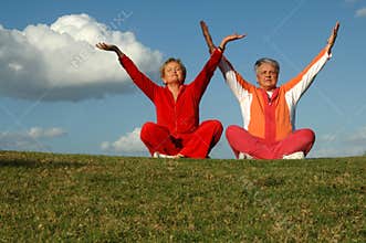 Senior women yoga outdoors